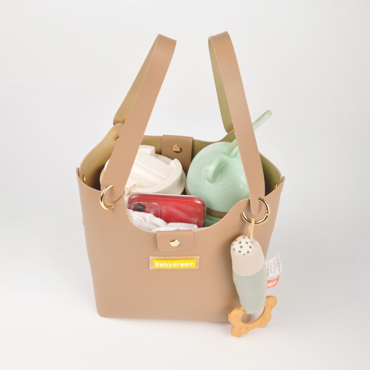 بيبي دريم حقيبة حفاضات جلدية بلون بيج للجنسين من عمر 13 سنة فما فوق